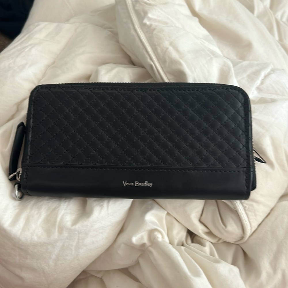 This is a very Bradley wallet with a blue flower design inside! Never been used